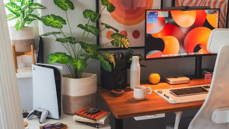 Workspace with notebook and plants