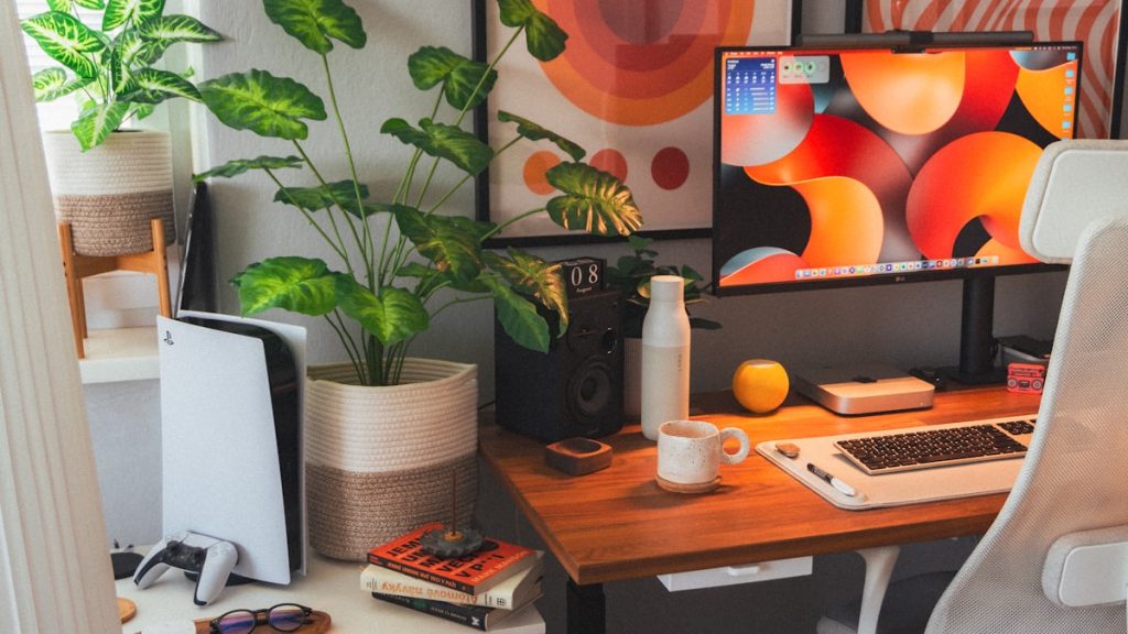 Workspace with notebook and plants